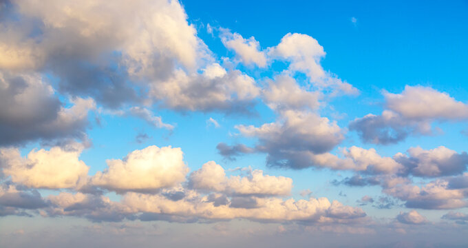 Blue sunset sky background with clouds. Can be used as a natural background. © Nikolay N. Antonov