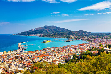 Aerial panoramic cityscape view of Zakynthos city, capital of the island Zakynthos in the Ionian sea in Greece. Summer sunny day - obrazy, fototapety, plakaty