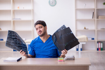 Young male doctor radiologist working in the clinic