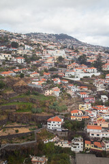 Fototapeta premium Aerial Shot of hill full of buildings at Funchal in Madeira Island