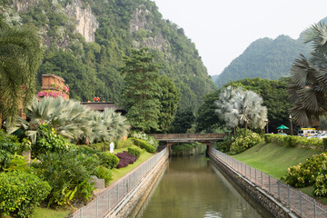 A beautiful outdoor garden that has a man made river