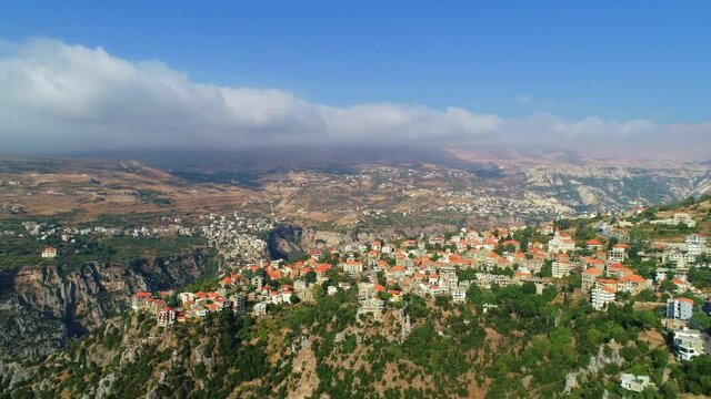 Village and valley view in partly cloudy weather