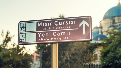 Fototapeta premium Touristic districts of Istanbul on a road sign. Spice Bazaar or Misir Carsisi in Turkish, also New Mosque or Yeni Camii in Turkish. Historical centers of Istanbul, Turkey