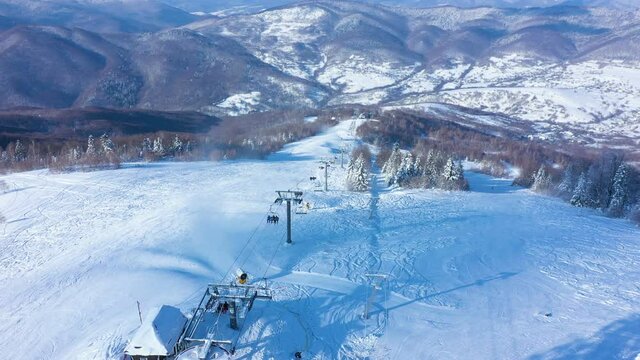 aerial view of ski slope  at the ski resort in the sunny winter morning
