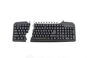 Broken keyboard on white background. Destroyed keyboard computer component. Black keyboard isolated...