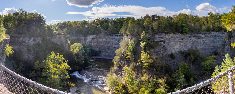 taughannock upper rim trail looking over cliff onto water bracketed