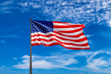 USA flag waving against sky