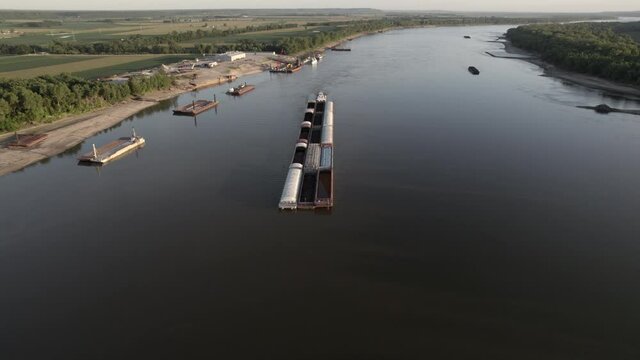 Aerial birds eye view over Mississippi river barge