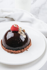 Chocolate mousse with fresh berries on marble table. Modern european desserts. Shallow focus