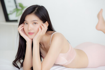 Beautiful portrait young asian woman sexy in underwear figure fit relax with seductive in bedroom,...