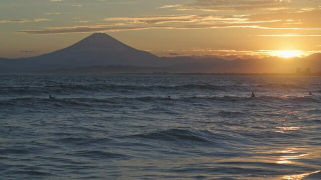 Stock footage of Mount Fuji at sunset from the beach, Enoshima, Japan
