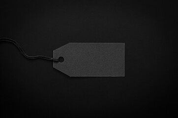 A black blank price tag on black background for shopping and discount on Black Friday concept.