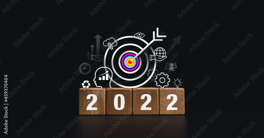 Poster 2022 happy new year banner with big goal target and successful concept. the 2022 numbers on wooden c