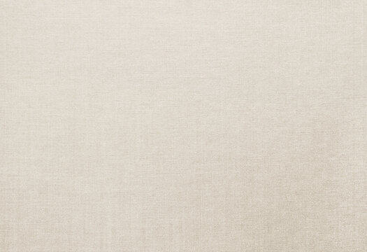 Natural linen texture background. Champagne gold colored cloth backdrop.
