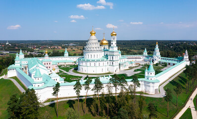 Fototapeta premium Picturesque summer aerial view of major monastery of Russian Orthodox Church in Moscow region, Resurrection Monastery located in historic area of Istra town..