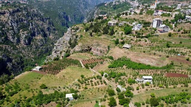 Hill Town Of Bsharri And Kadisha Valley In Lebanon - aerial drone shot