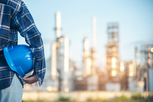 Electrician engineer woman hand holding Blue hard hat. Technical operator  worker hardhat blue work helmet Engineering. Electrician woman worker oil petro industry safety at work blue worker helmet.
