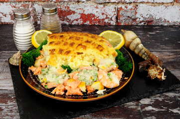 Mashed potato topped baked fisherman pie a traditional British meal