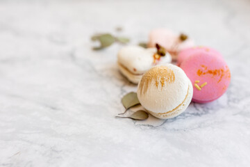 Macaroons close up. Pink and white macaroons on the murble table