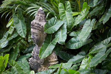 Ancient Buddha statue, closeup. In a quiet and comfortable natural environment 