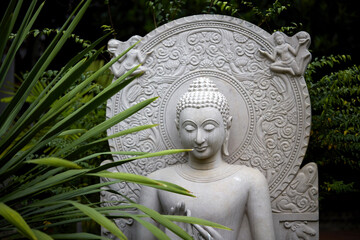 Ancient Buddha statue, closeup. In a quiet and comfortable natural environment 
