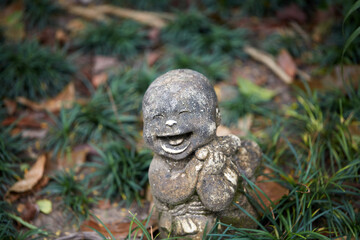 Old little sand statue, closeup. In a quiet and comfortable natural environment
