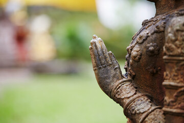 Ancient Buddha statue, closeup. In a quiet and comfortable natural environment