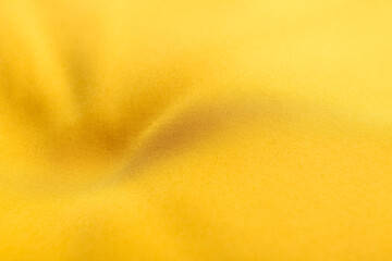 Texture of color fabric with folds as background, closeup