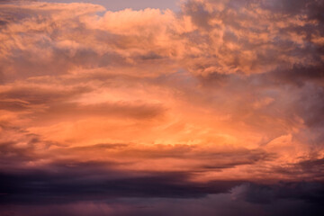 Naklejka na ściany i meble A dark and moody pink cloudy sky over Melbourne, Australia