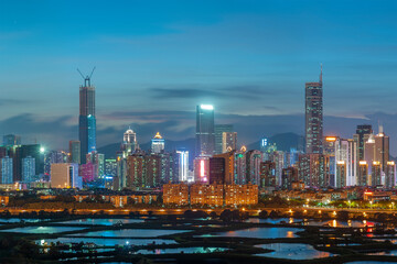 Fototapeta premium Night scenery of panorama of skyline of Shenzhen city, China. Viewed from Hong Kong border