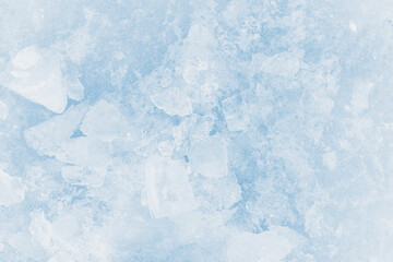Ice pieces texture background. Crushed ice blue-toned pattern.