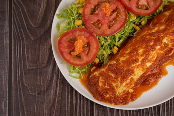 Pancake with dressing and salad