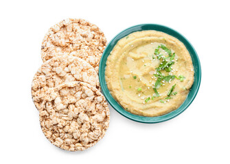 Bowl with tasty baba ghanoush and rice crackers on white background