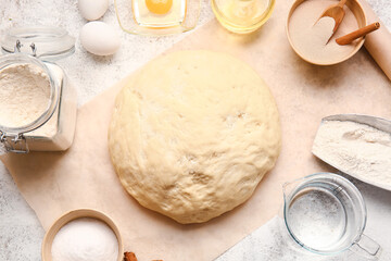 Composition with fresh dough on light background