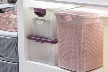 Organization of home space and comfort, plastic boxes containers for wardrobe closets, household...