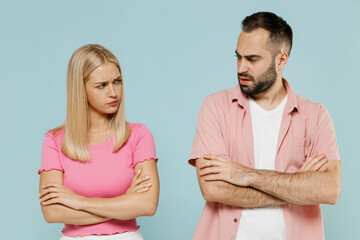 Young offended arguing couple two friends family man woman in casual clothes hold hands crossed...