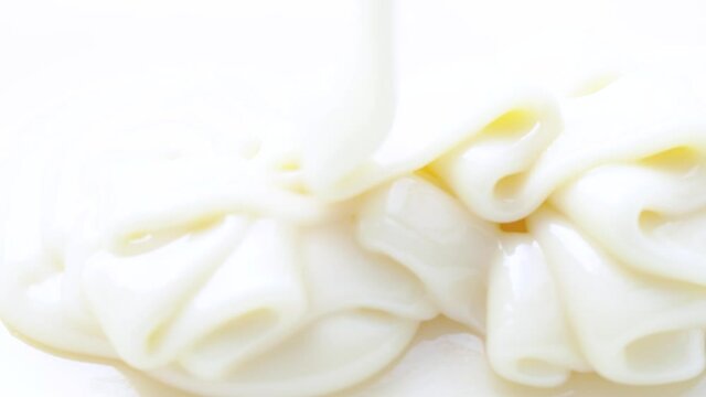 White yogurt, sauce, milk, caramel texture, close up abstract beige cream motion