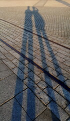 Shadow of men on the floor in the evening.