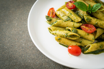 penne pasta with pesto sauce and tomatoes