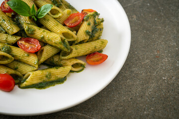 penne pasta with pesto sauce and tomatoes