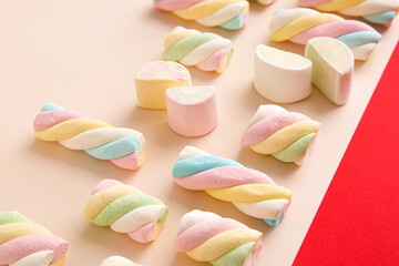 Tasty marshmallows on color background, closeup