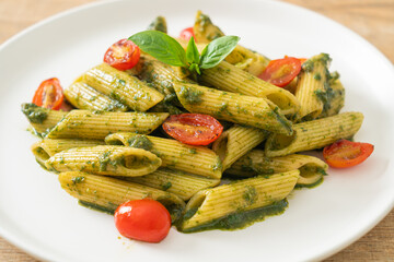 penne pasta with pesto sauce and tomatoes