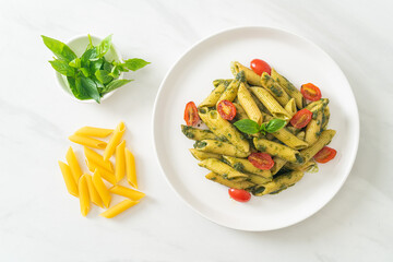 penne pasta with pesto sauce and tomatoes