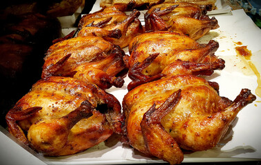 Roasted chicken on white plate. 