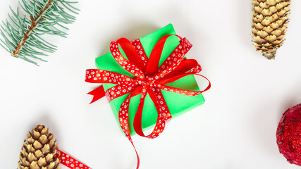 Green Gift boxs and Christmas decorations on white background, flat lay. Winter holidays theme. Happy new year concept.