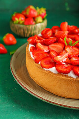 Plate with sweet strawberry pie on table