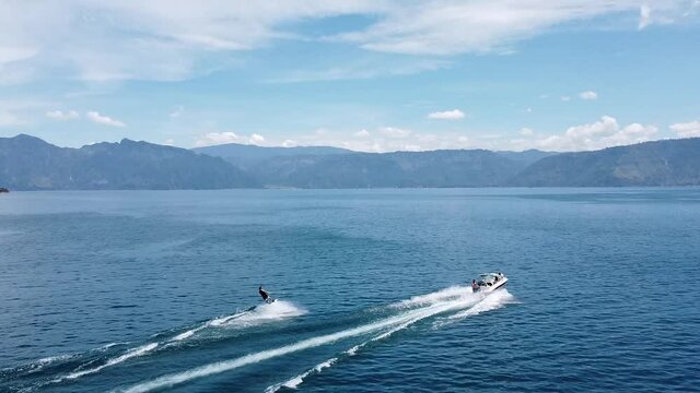 man practicing wakeboard on a lake
