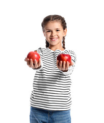 Little girl with apple and pomegranate on white background