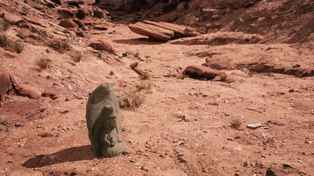 Ancient Statue on the Rocks Desert