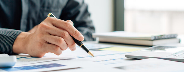 Close up view of bookkeeper or financial inspector hands making report, calculating or checking balance. Home finances, investment, economy, saving money or insurance concept.